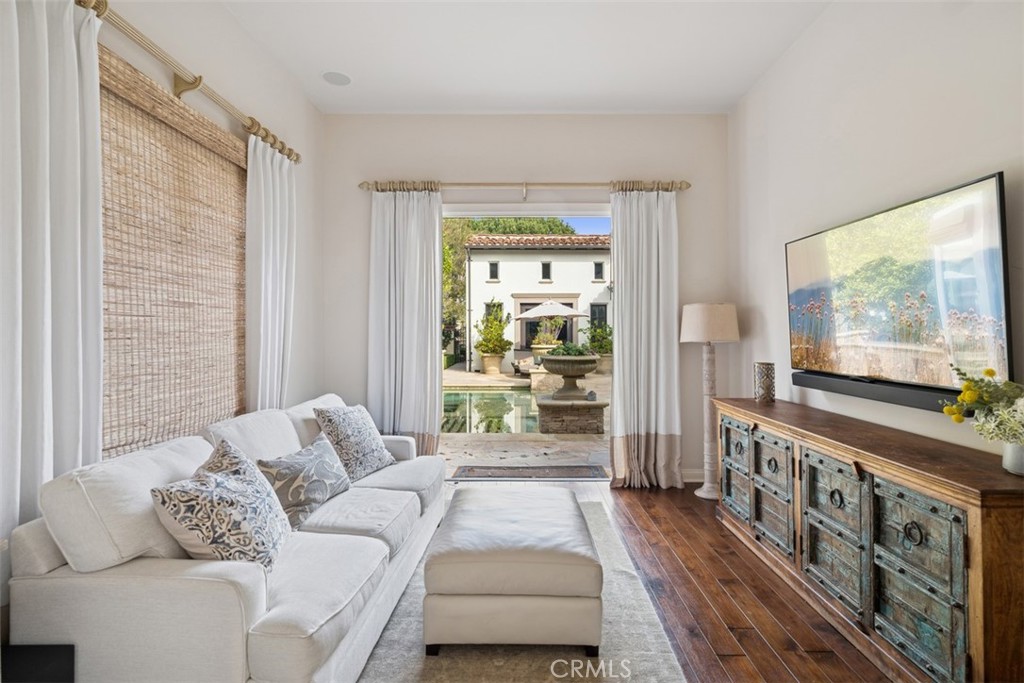25 Wild Hawk Irvine, CA 92603 - Photo 27 of 36 a living room with furniture and a flat screen tv