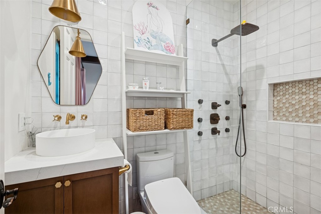 25 Wild Hawk Irvine, CA 92603 - Photo 32 of 36 a bathroom with a sink toilet and shower