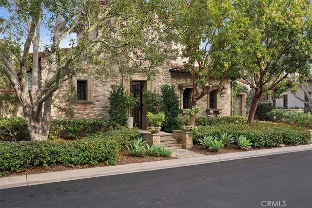 a view of a patio with table and chairs with wooden floor and fence