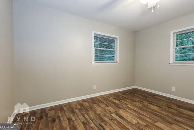 a view of a room with wooden floor and closet