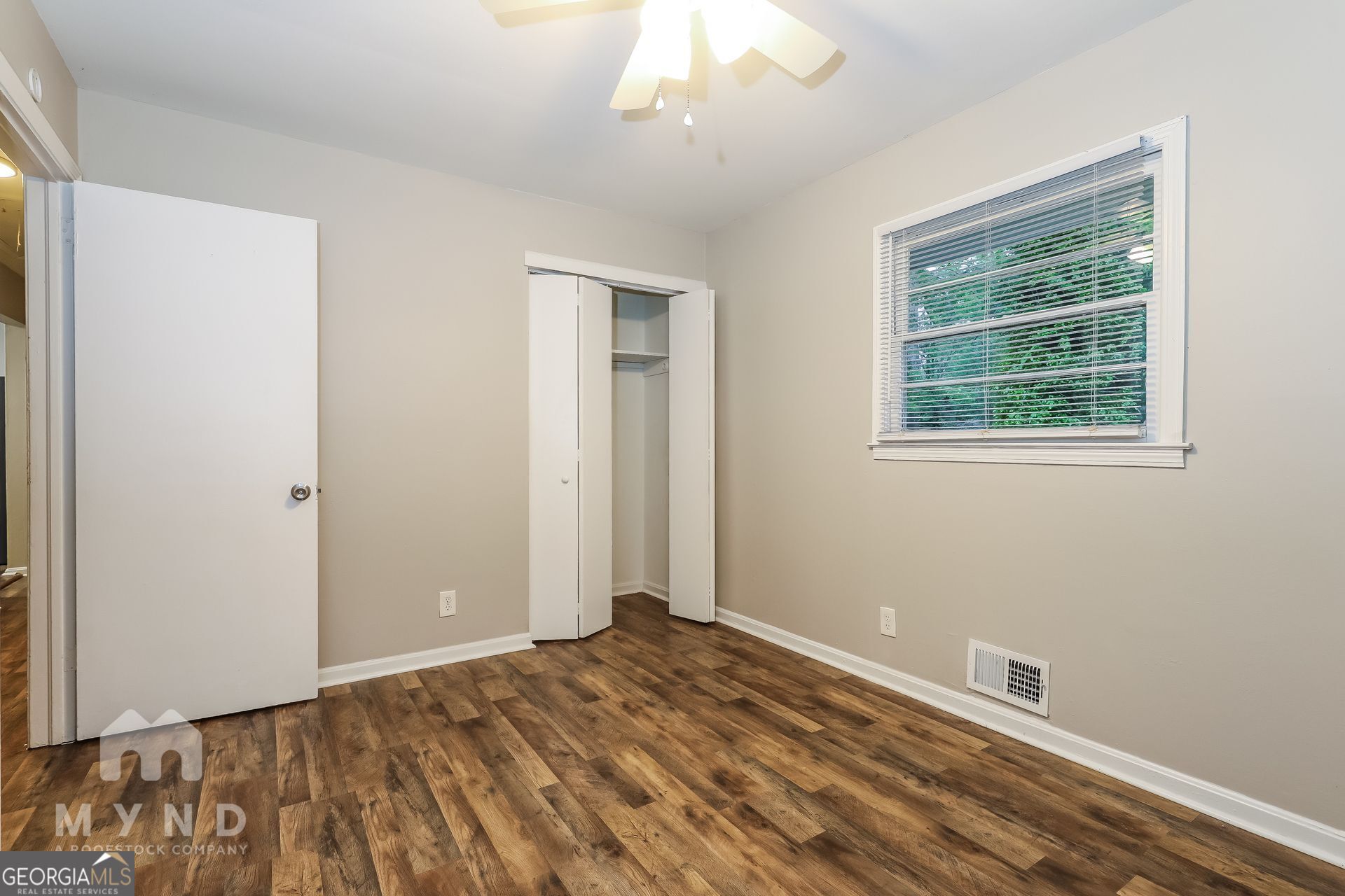 2644 Butner Road Atlanta, GA 30331 - Photo 16 of 21 a view of empty room with wooden floor and fan