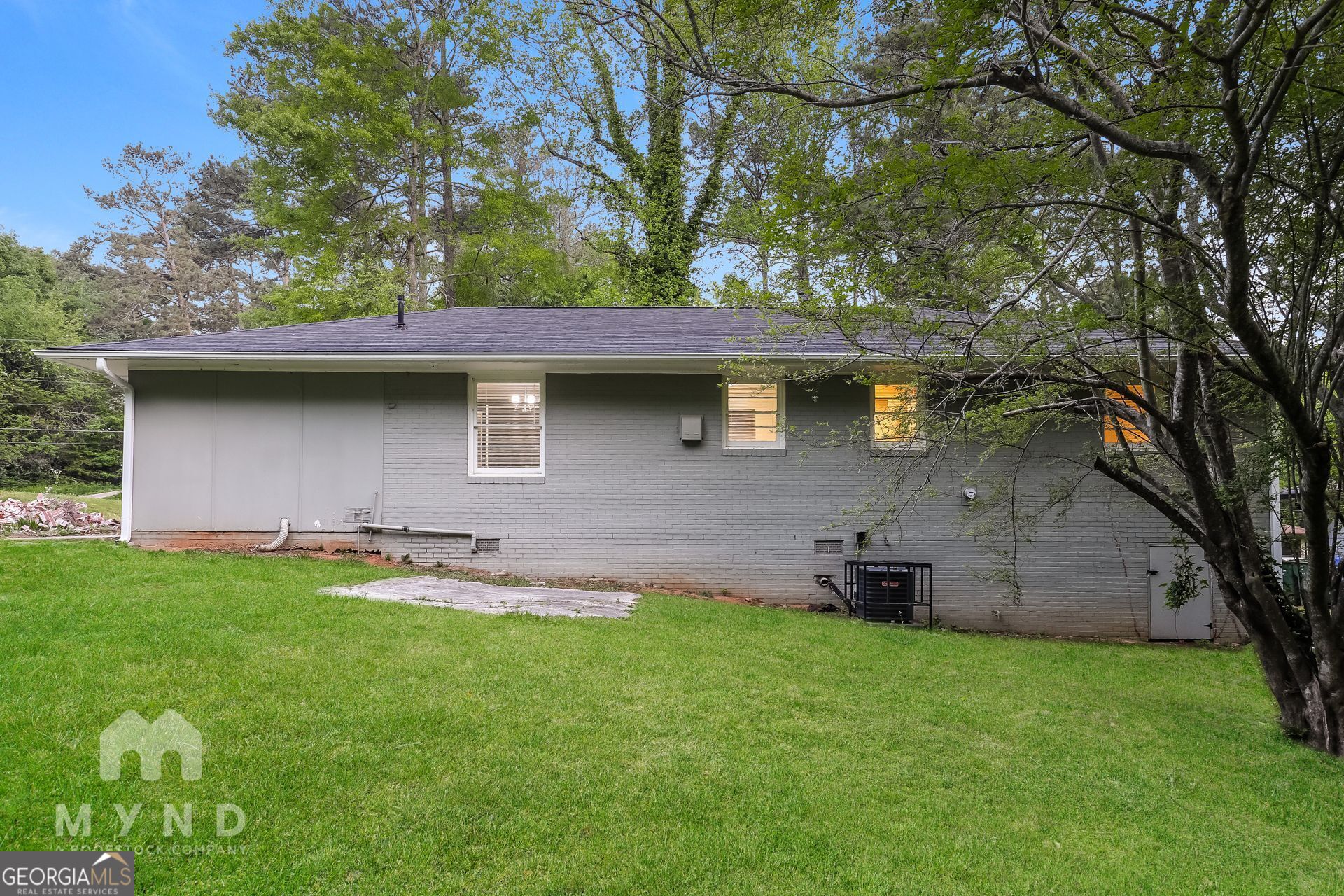 2644 Butner Road Atlanta, GA 30331 - Photo 18 of 21 a backyard of a house with table and chairs