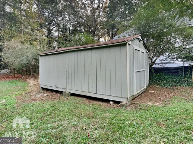 a view of a field with an trees