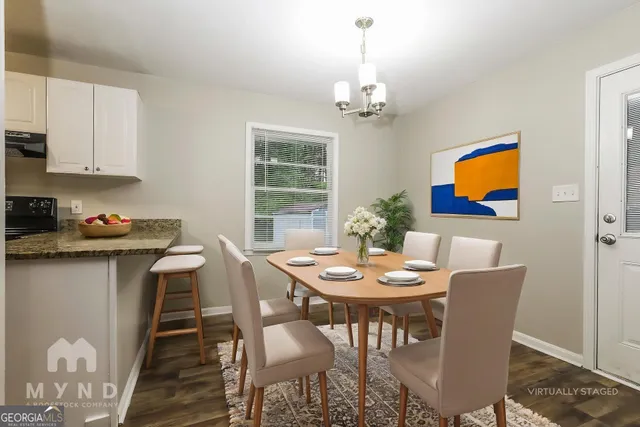 a view of a livingroom with a kitchen