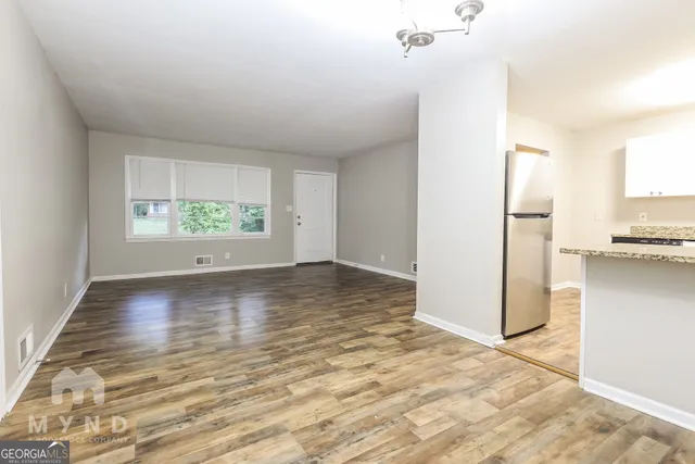 a view of room with window and hardwood floor