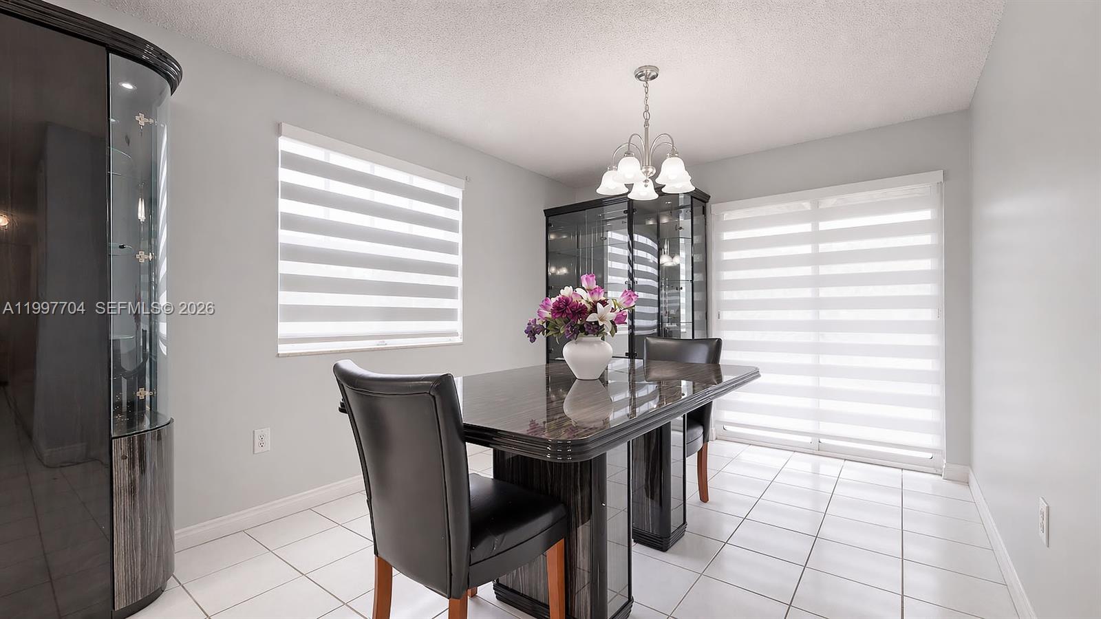 21450 Southwest 109th Court Miami, FL 33170 - Photo 16 of 43 a dining room with furniture and window