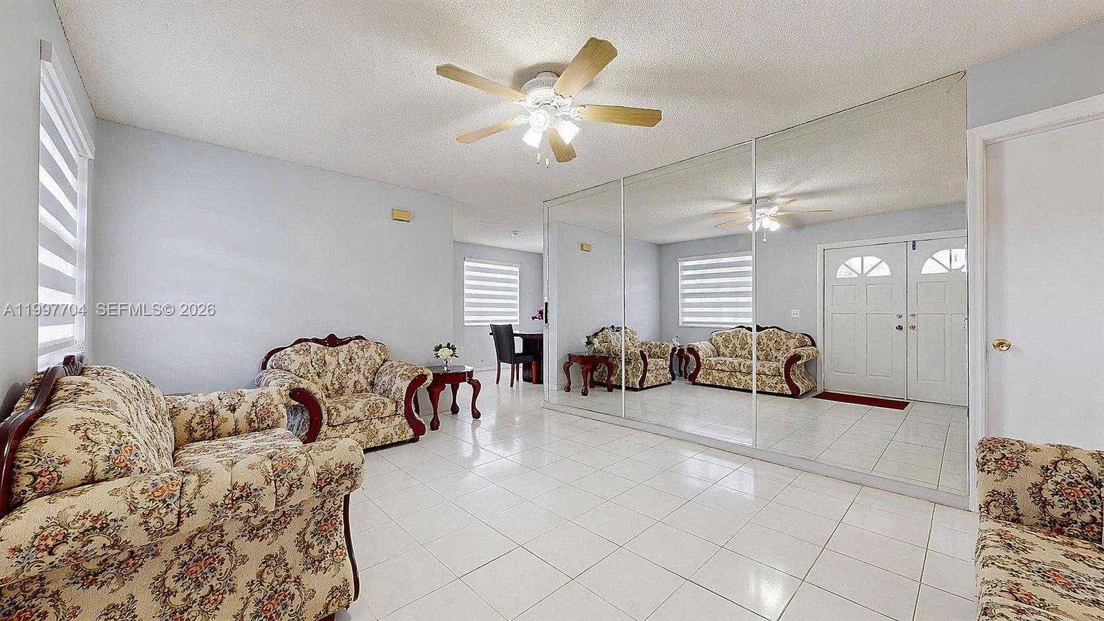21450 Southwest 109th Court Miami, FL 33170 - Photo 21 of 43 a bed room with a bed and a couch