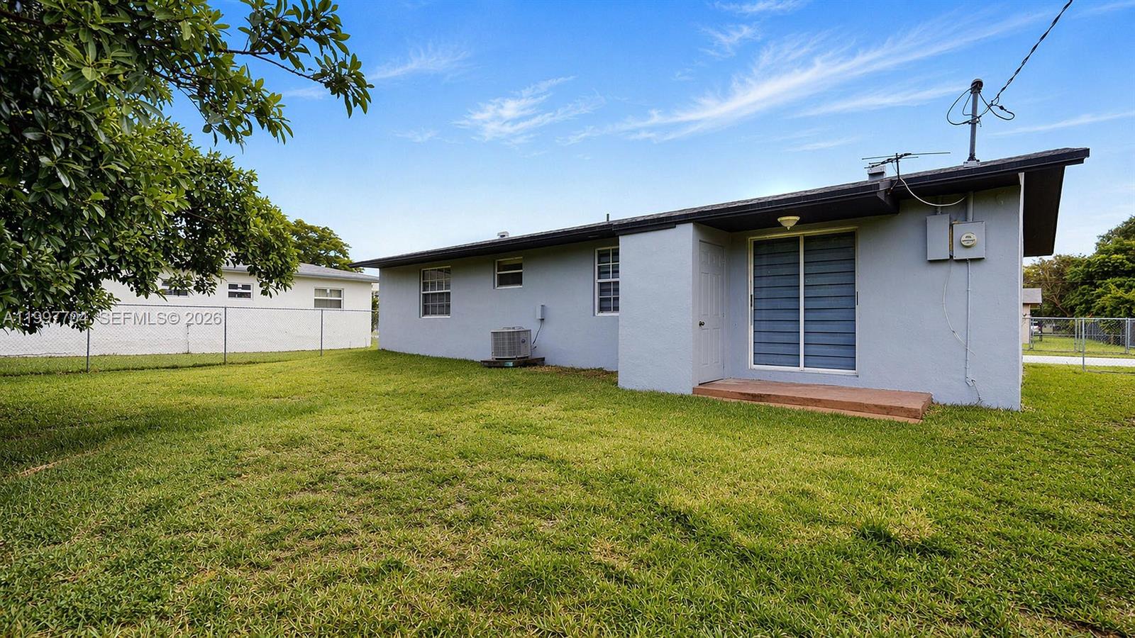 21450 Southwest 109th Court Miami, FL 33170 - Photo 28 of 43 a house view with a garden space