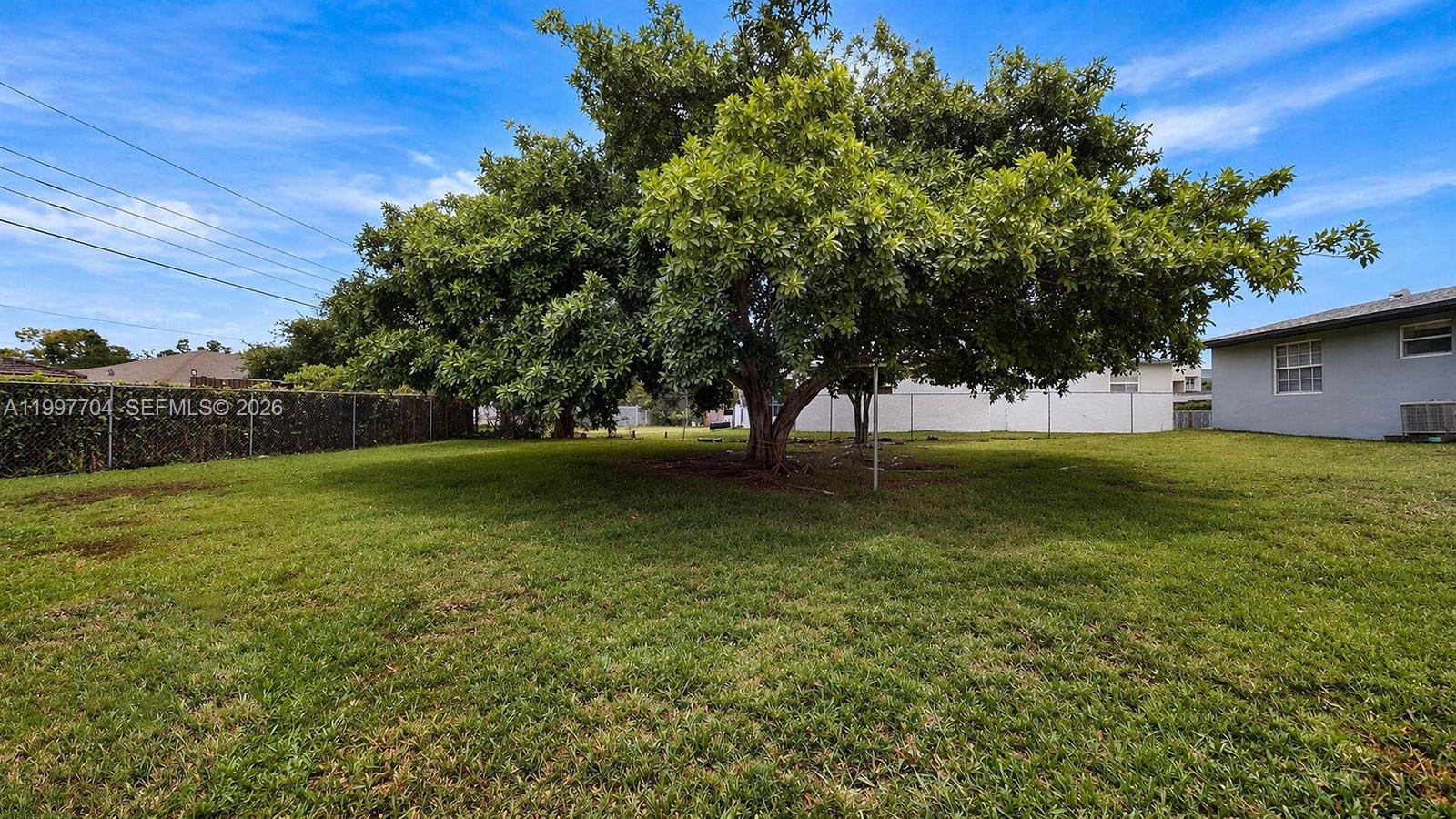 21450 Southwest 109th Court Miami, FL 33170 - Photo 29 of 43 a view of outdoor space with deck and yard