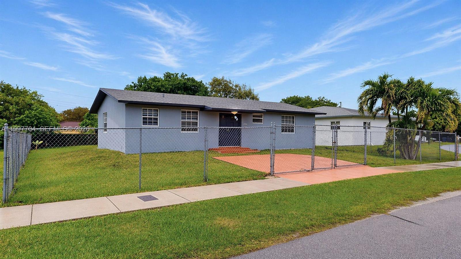 21450 Southwest 109th Court Miami, FL 33170 - Photo 32 of 43 a view of a backyard with a garden and plants