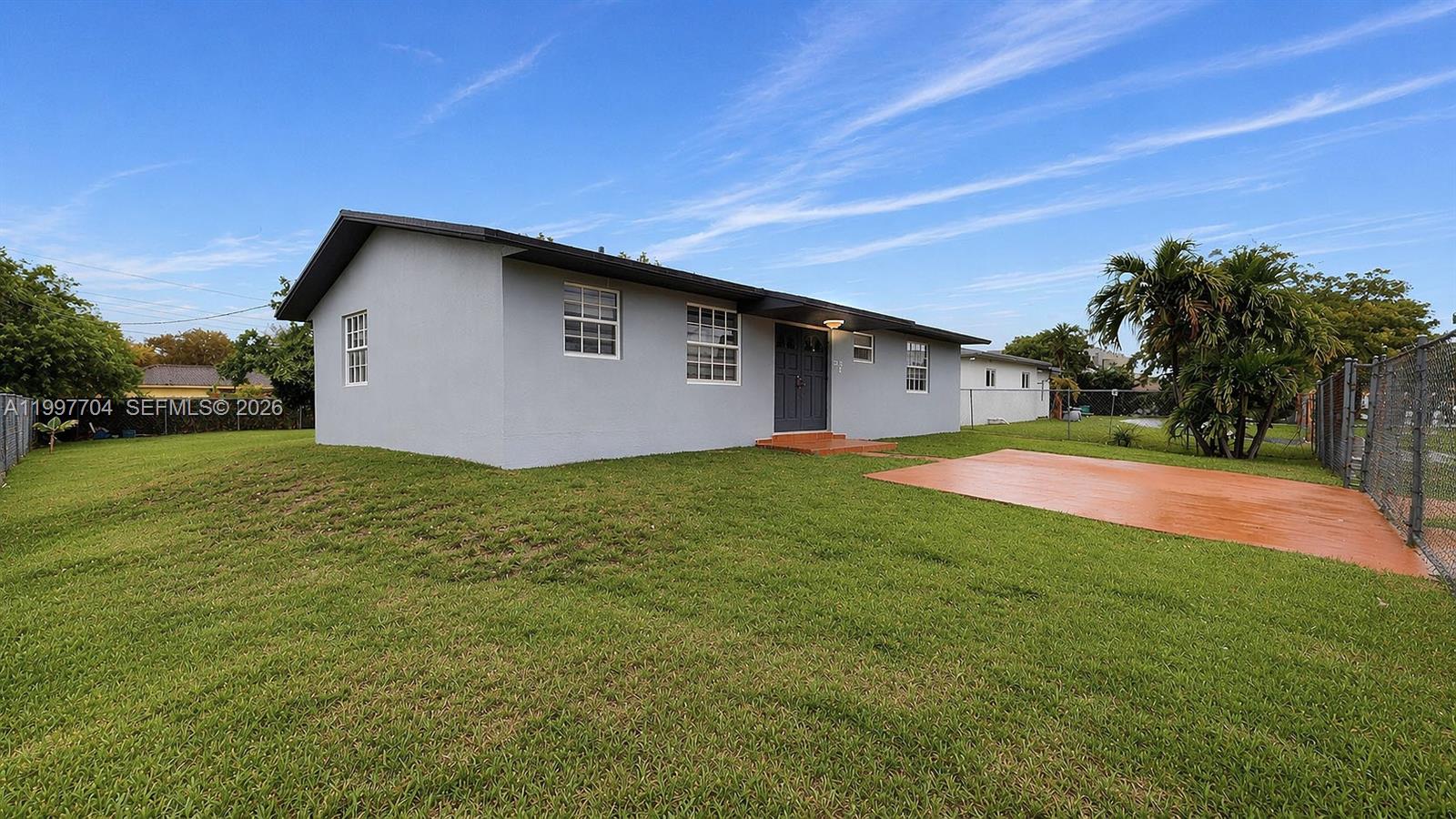 21450 Southwest 109th Court Miami, FL 33170 - Photo 34 of 43 a backyard of a house with lots of green space