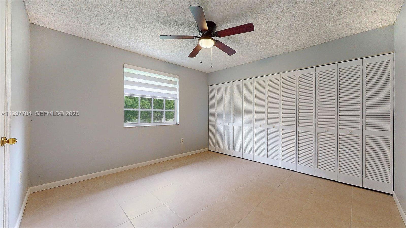 21450 Southwest 109th Court Miami, FL 33170 - Photo 35 of 43 a view of an empty room with a window