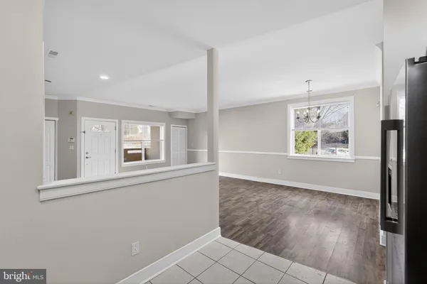 an empty room with windows and entrance