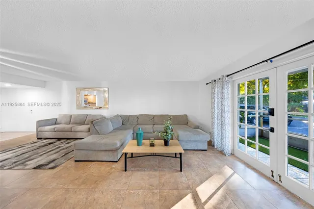 a living room with furniture and a table