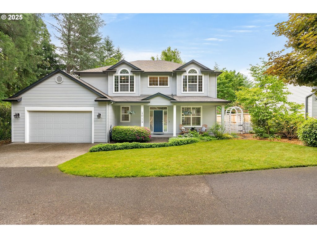 4014 Southwest 96th Avenue Portland, OR 97225 - Photo 1 of 48 a front view of a house with a garden and yard