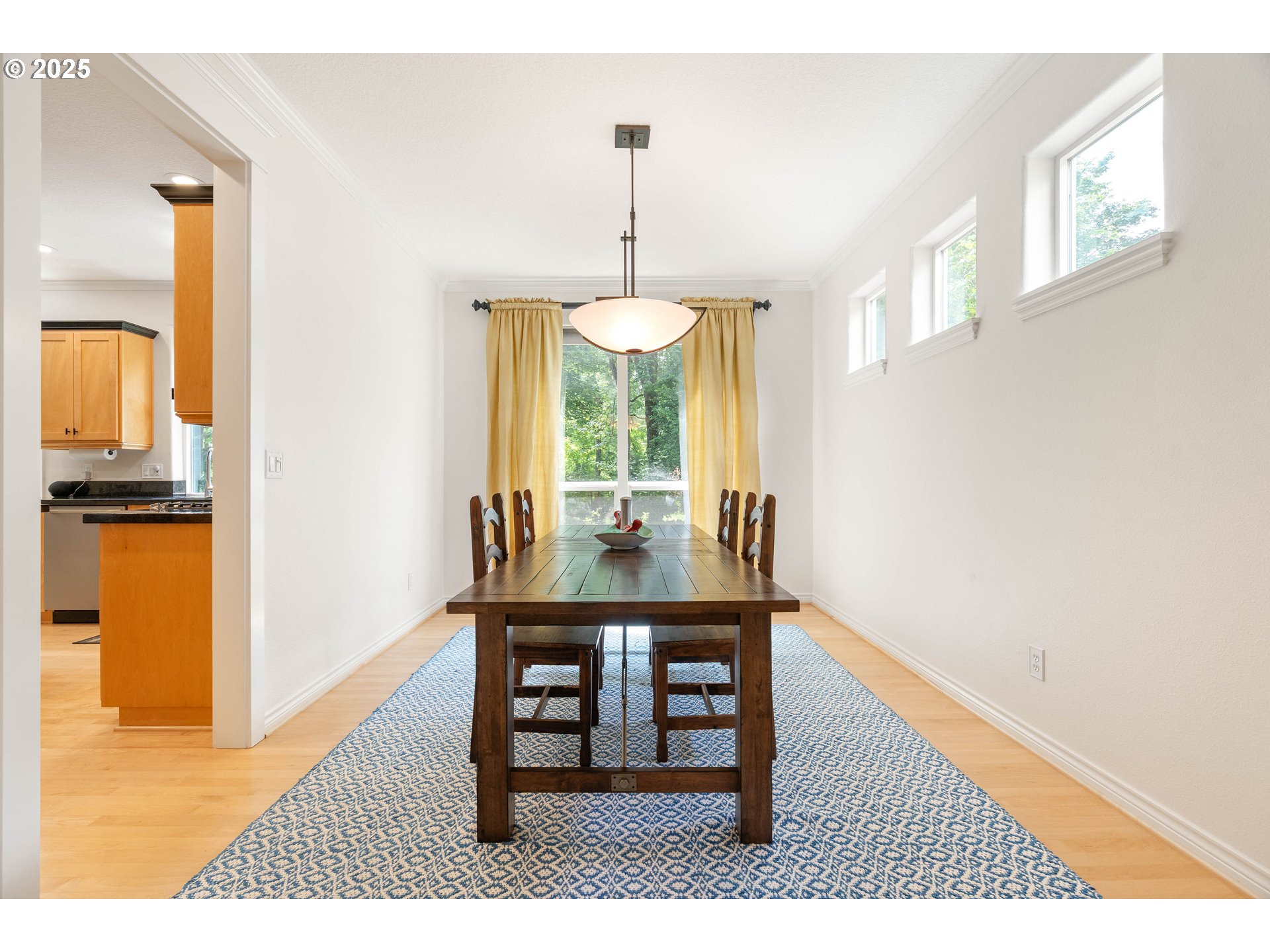 4014 Southwest 96th Avenue Portland, OR 97225 - Photo 16 of 48 a view of a dining room with furniture window and wooden floor