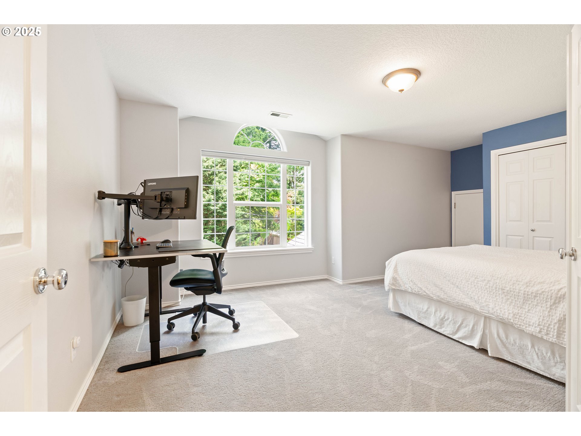 4014 Southwest 96th Avenue Portland, OR 97225 - Photo 21 of 48 a bedroom with a bed a desk and chair