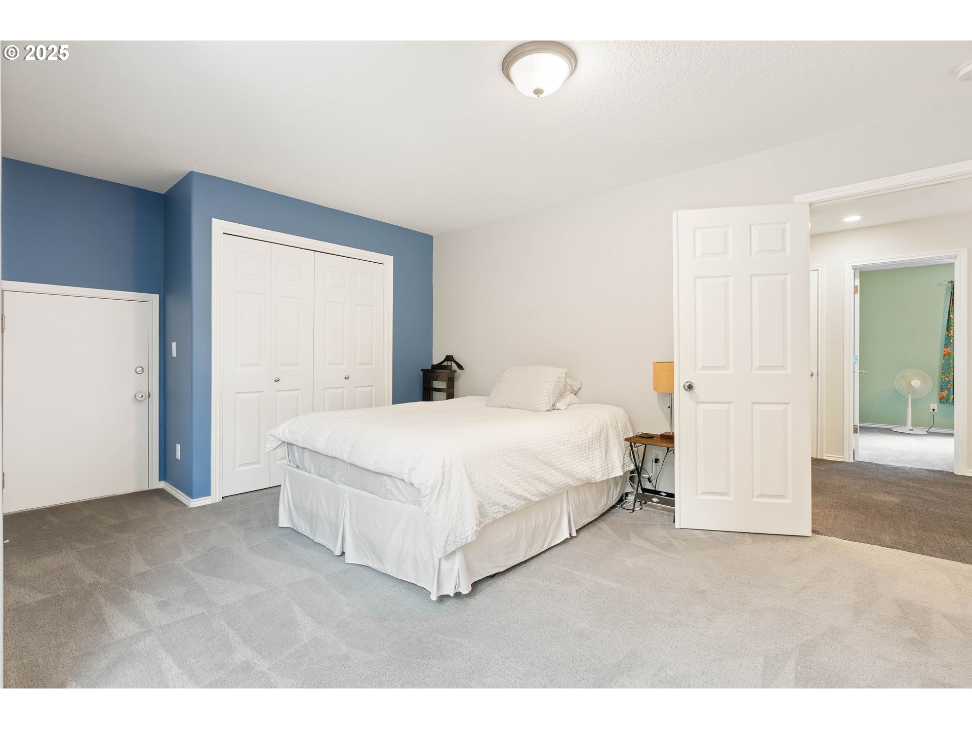4014 Southwest 96th Avenue Portland, OR 97225 - Photo 22 of 48 a spacious bedroom with a bed and a cabinets