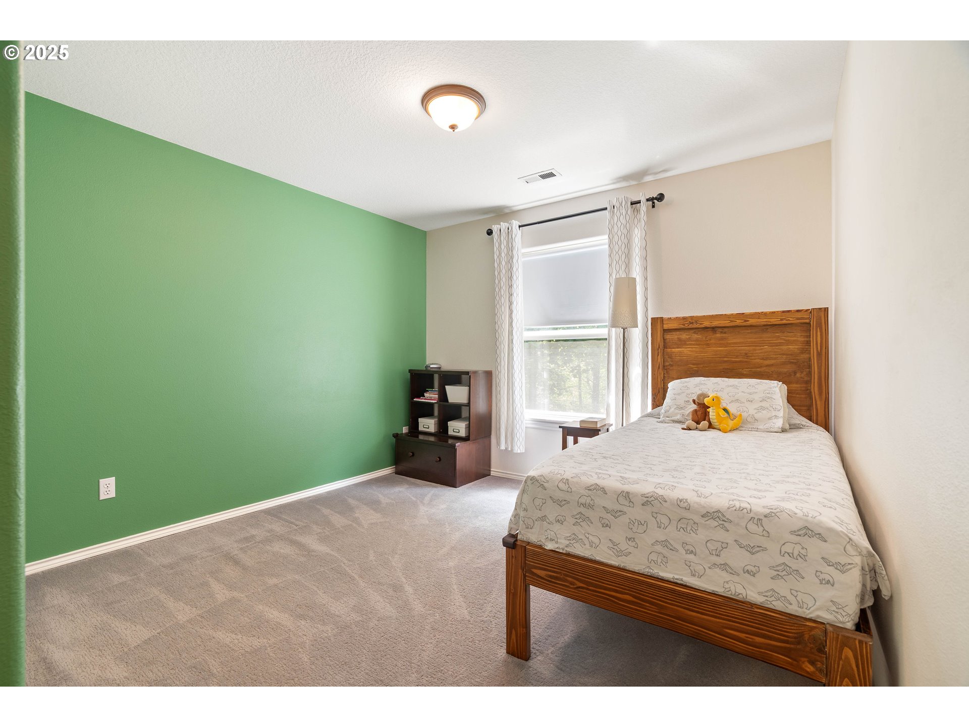4014 Southwest 96th Avenue Portland, OR 97225 - Photo 25 of 48 a bedroom with a bed and a window