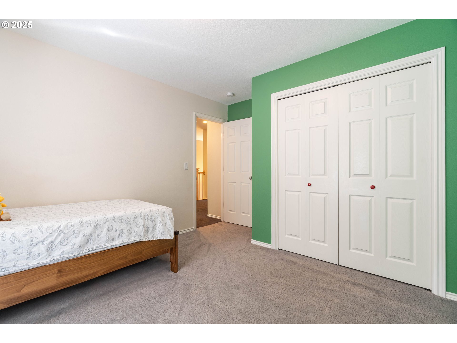 4014 Southwest 96th Avenue Portland, OR 97225 - Photo 26 of 48 a spacious bedroom with a bed and a cabinets