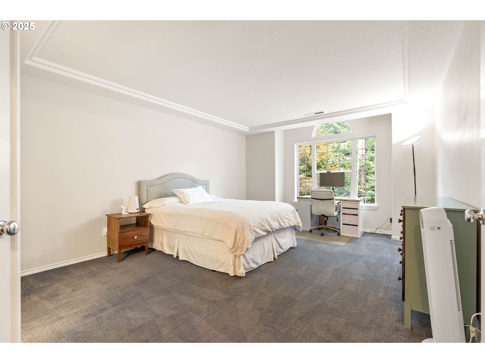 4014 Southwest 96th Avenue Portland, OR 97225 - Photo 29 of 48 a spacious bedroom with a bed and a large window