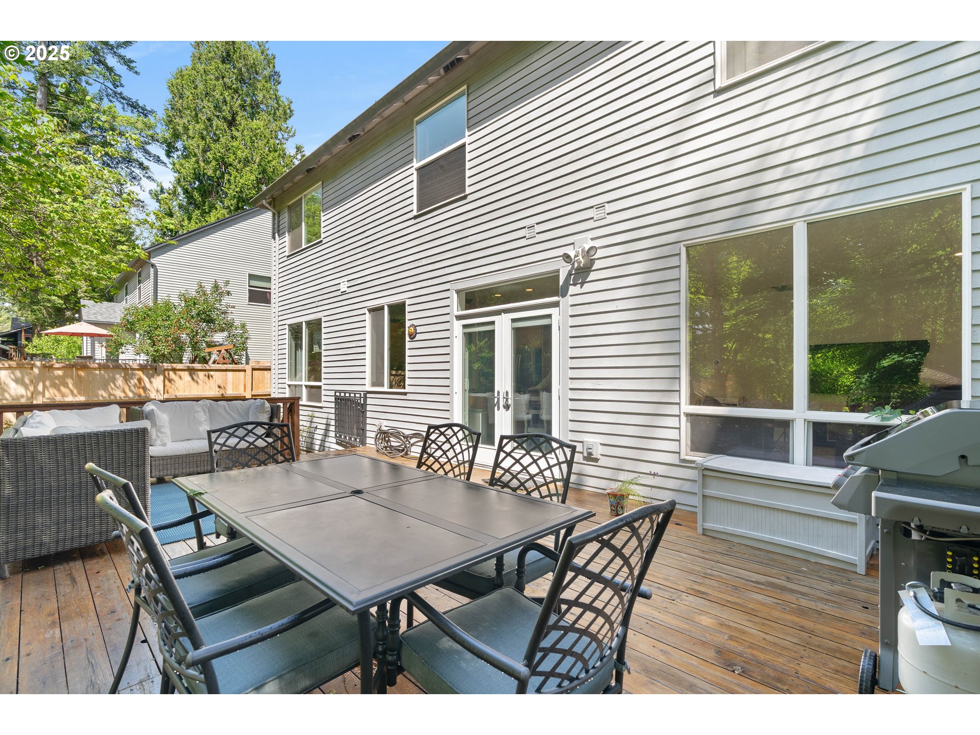 4014 Southwest 96th Avenue Portland, OR 97225 - Photo 37 of 48 a backyard of a house with table and chairs