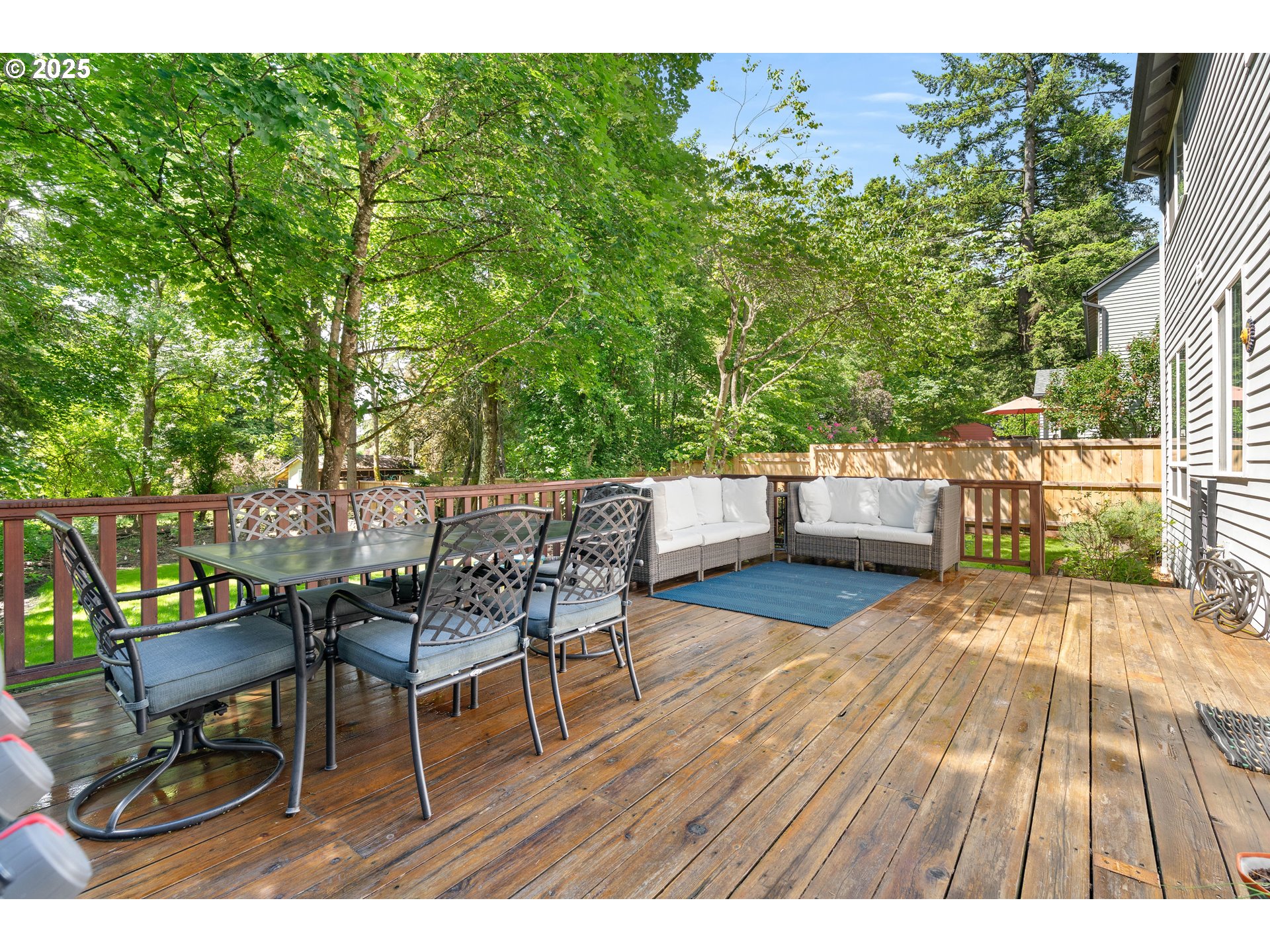 4014 Southwest 96th Avenue Portland, OR 97225 - Photo 39 of 48 a view of a chairs and table on the wooden deck