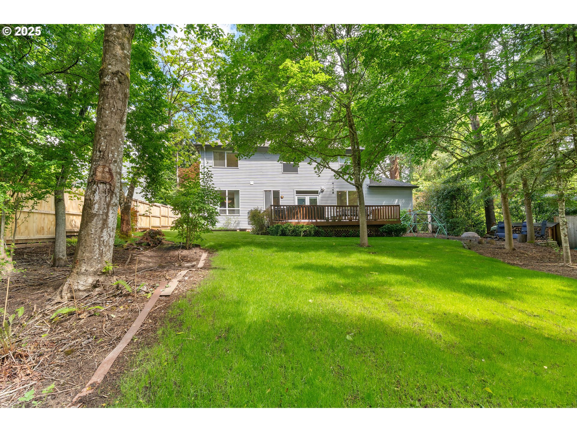 4014 Southwest 96th Avenue Portland, OR 97225 - Photo 43 of 48 a view of house with backyard and trees