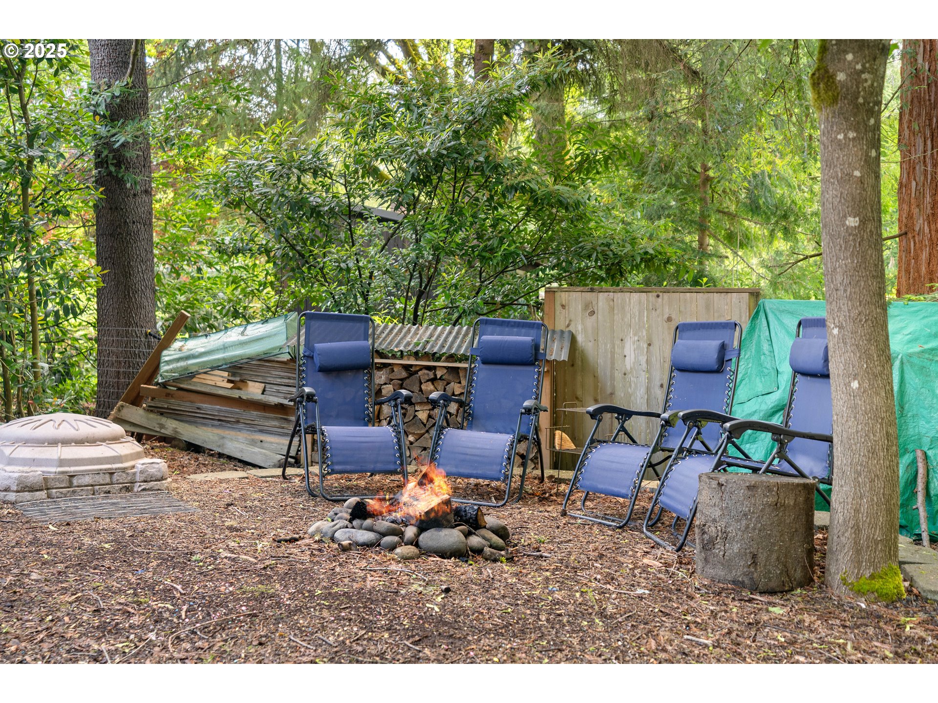 4014 Southwest 96th Avenue Portland, OR 97225 - Photo 48 of 48 a backyard of a house with fire pit and outdoor seating