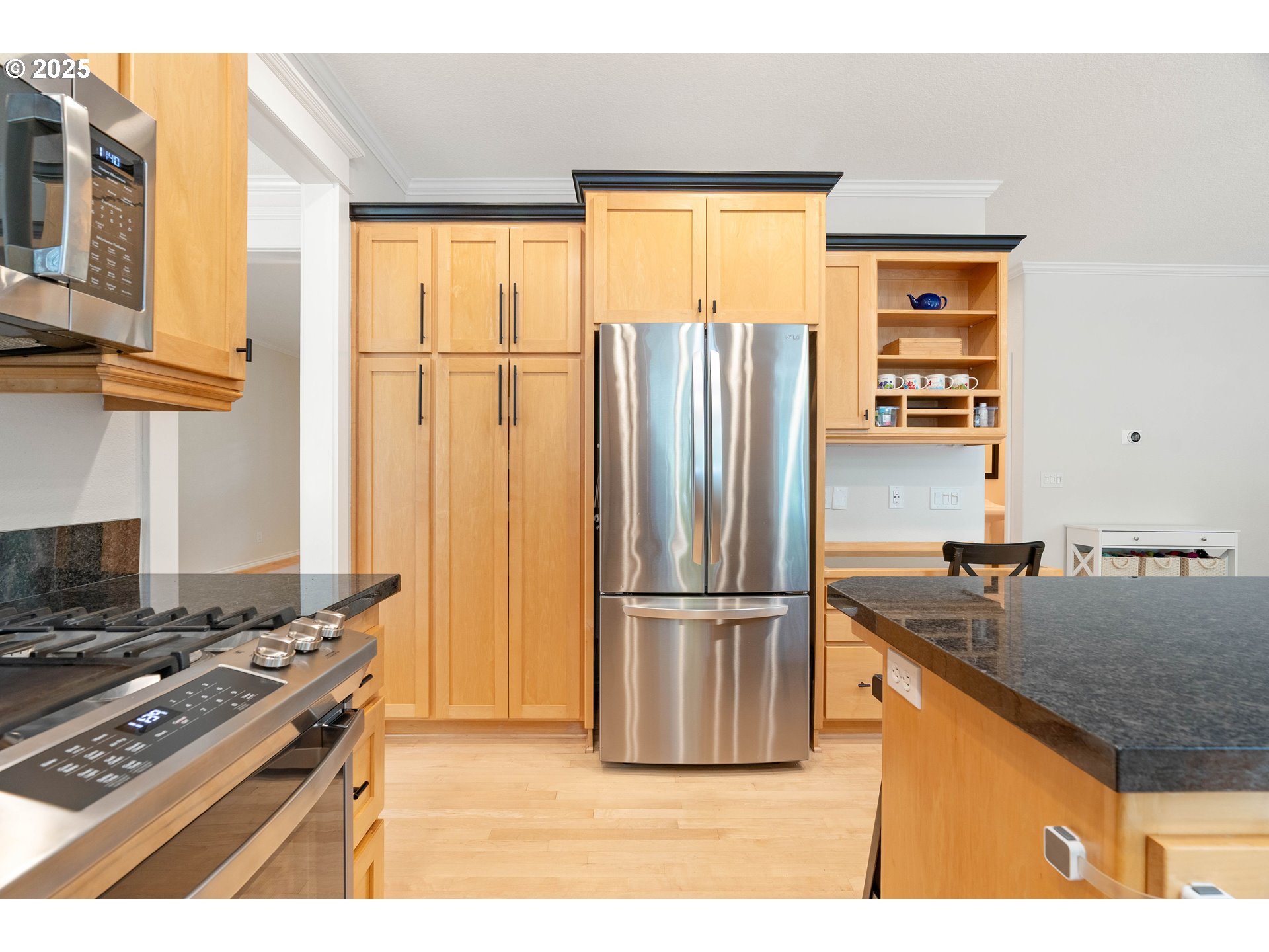 4014 Southwest 96th Avenue Portland, OR 97225 - Photo 8 of 48 a kitchen with stainless steel appliances granite countertop a refrigerator and a stove