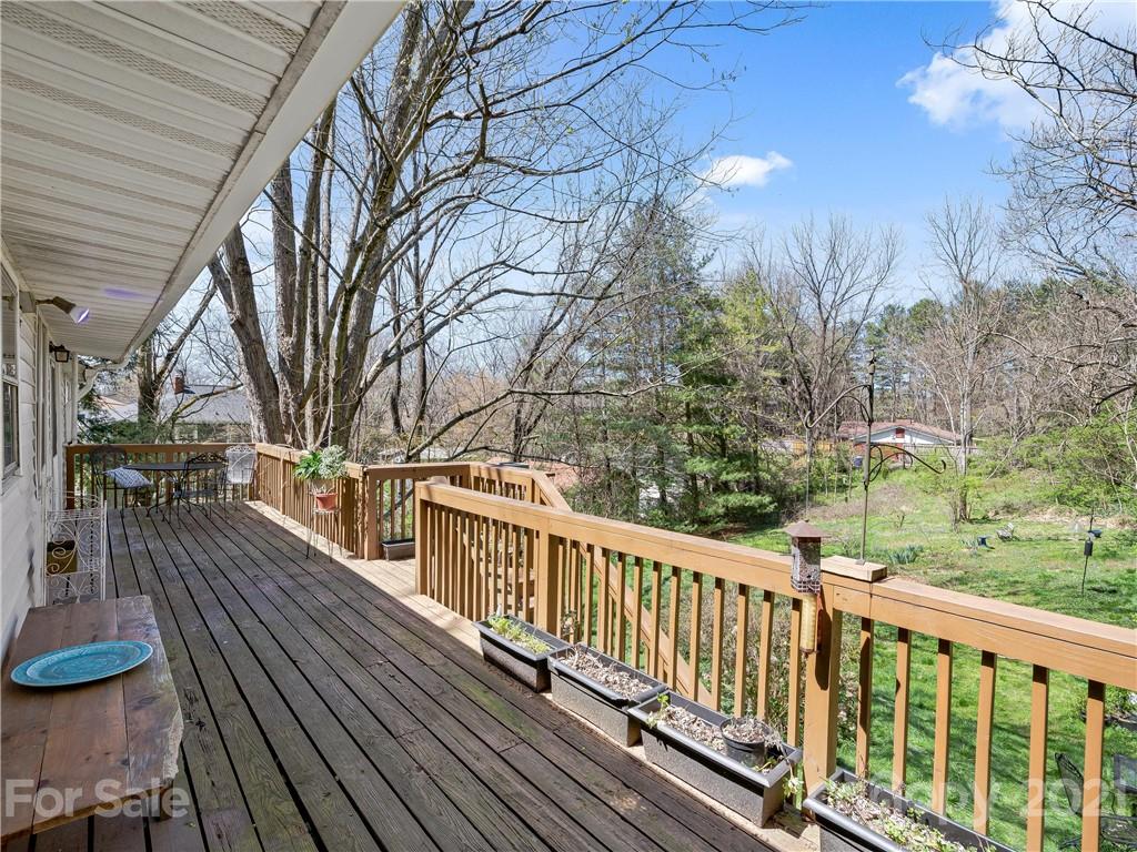 604 Fairview Road Asheville, NC 28803 - Photo 9 of 18 a view of a balcony with wooden floor and outdoor space