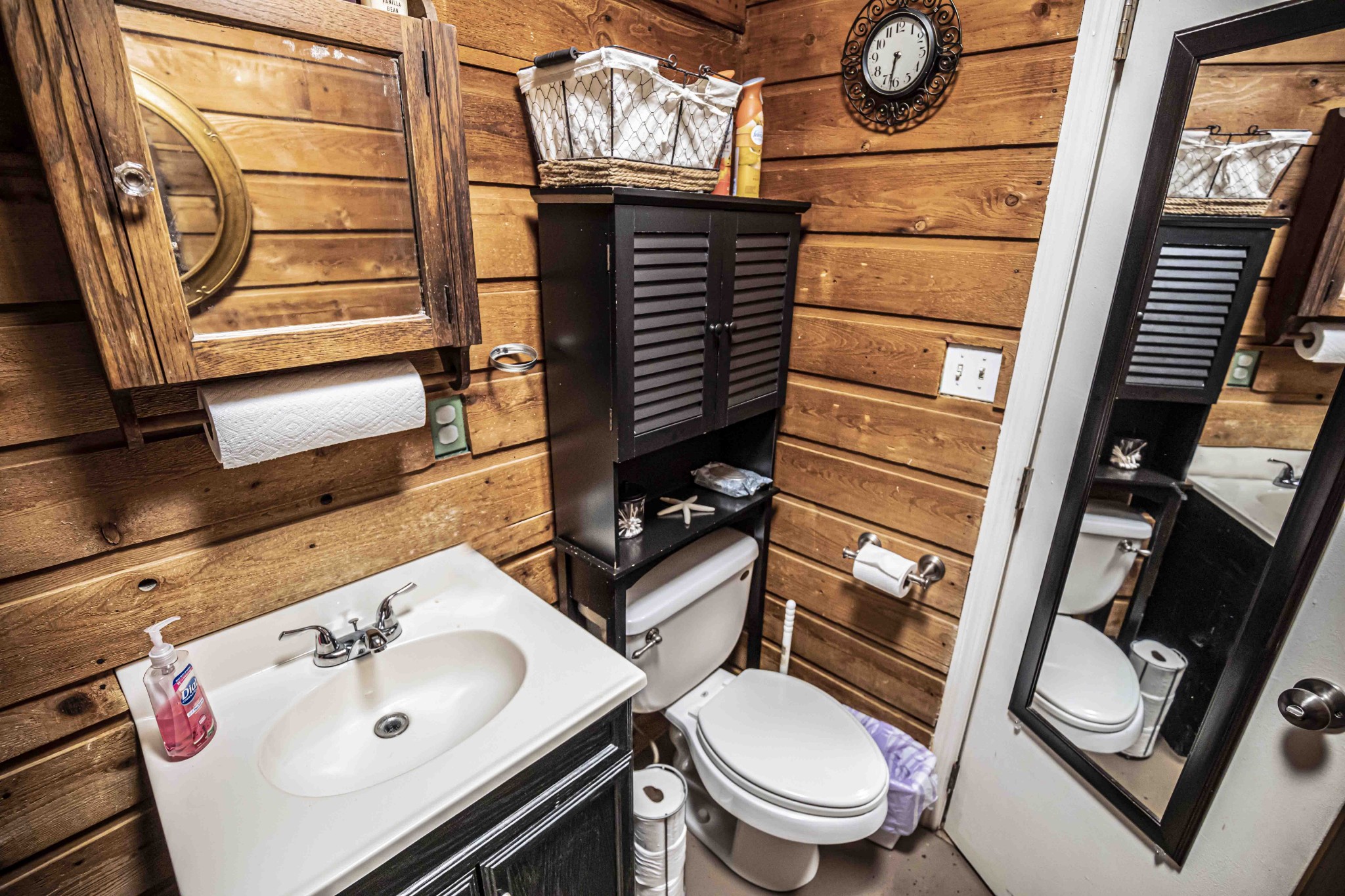 8781 Richards Road Lyles, TN 37098 - Photo 26 of 50 a bathroom with a sink a toilet and mirror