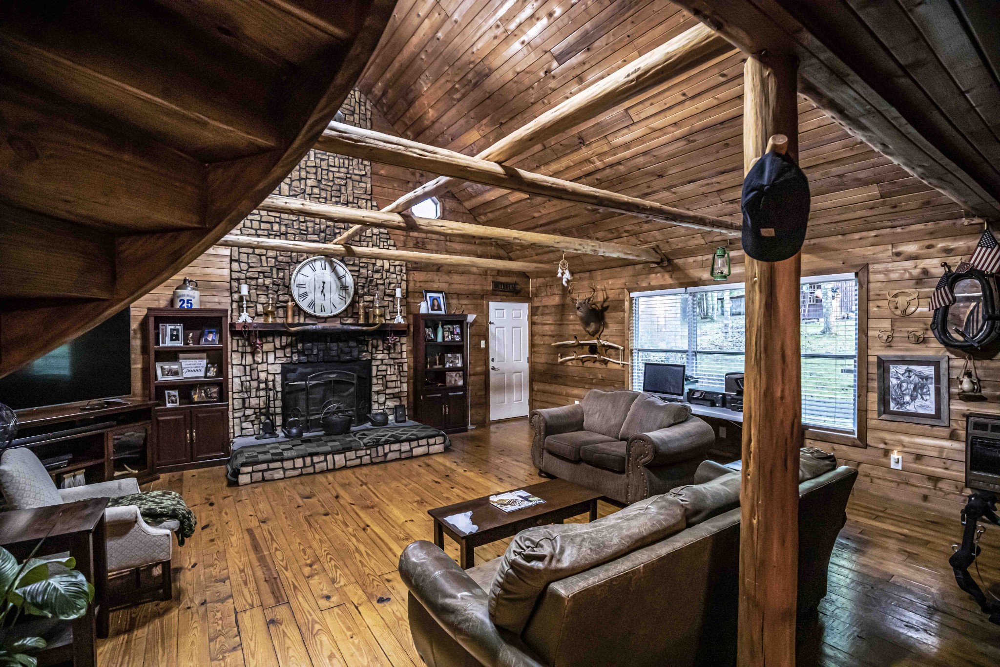 8781 Richards Road Lyles, TN 37098 - Photo 30 of 50 a living room with fireplace furniture and a flat screen tv