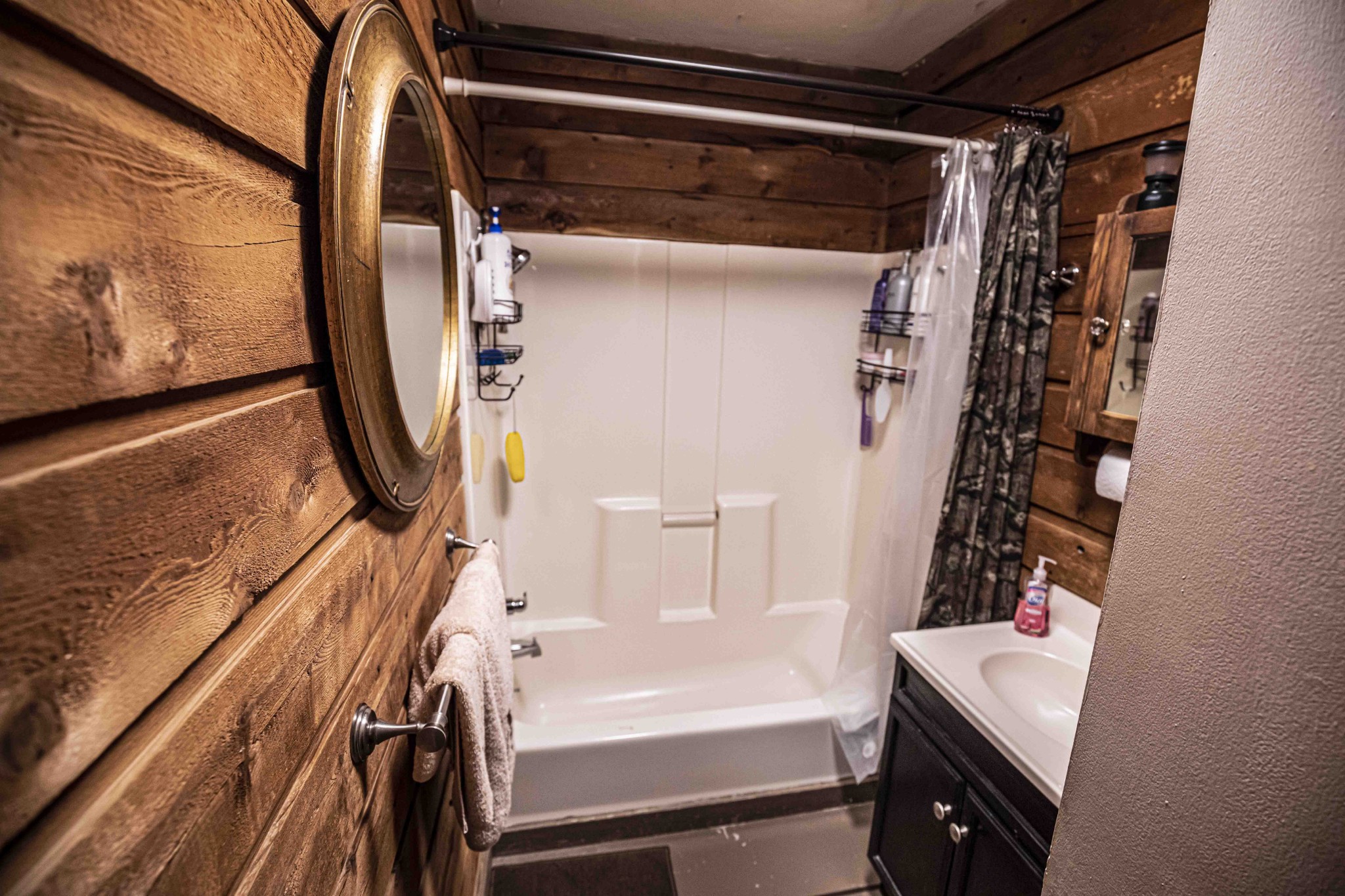 8781 Richards Road Lyles, TN 37098 - Photo 45 of 50 a bathroom with a bathtub and shower