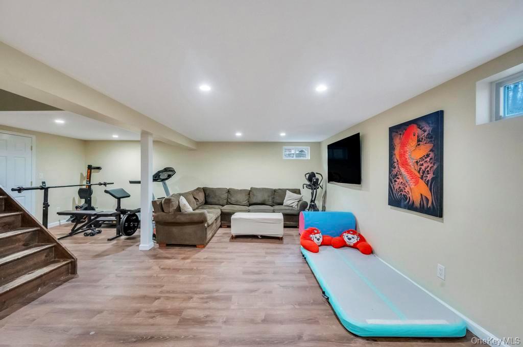 39 Bevin Road Northport, NY 11768 - Photo 34 of 44 Basement Game room with light wood-style floors and recessed lighting