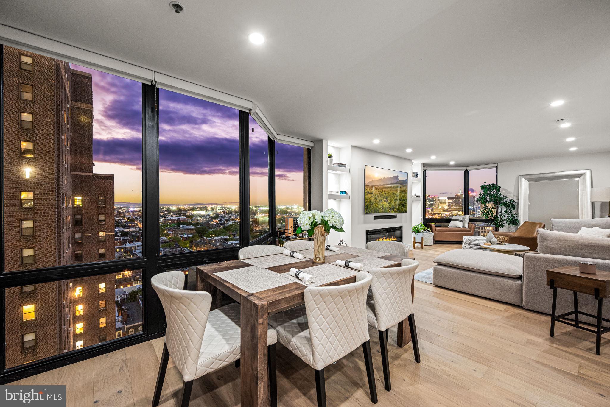 2020 Walnut Street, Unit 19LM Philadelphia, PA 19103 - Photo 11 of 60 a dining room with furniture and a floor to ceiling window
