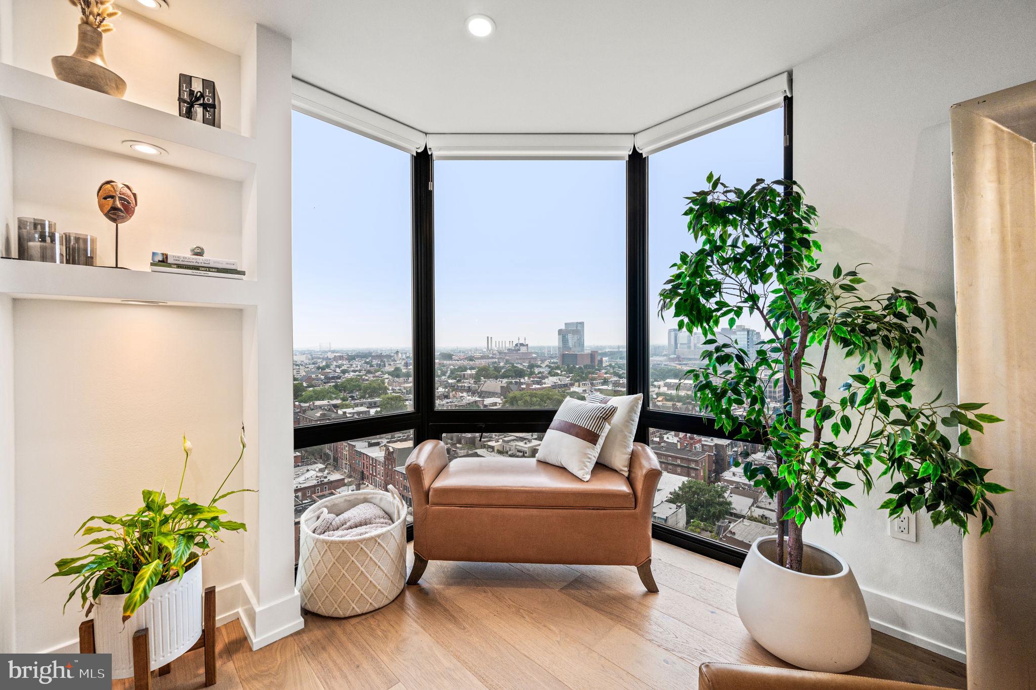 2020 Walnut Street, Unit 19LM Philadelphia, PA 19103 - Photo 12 of 60 a living room with furniture and a potted plant