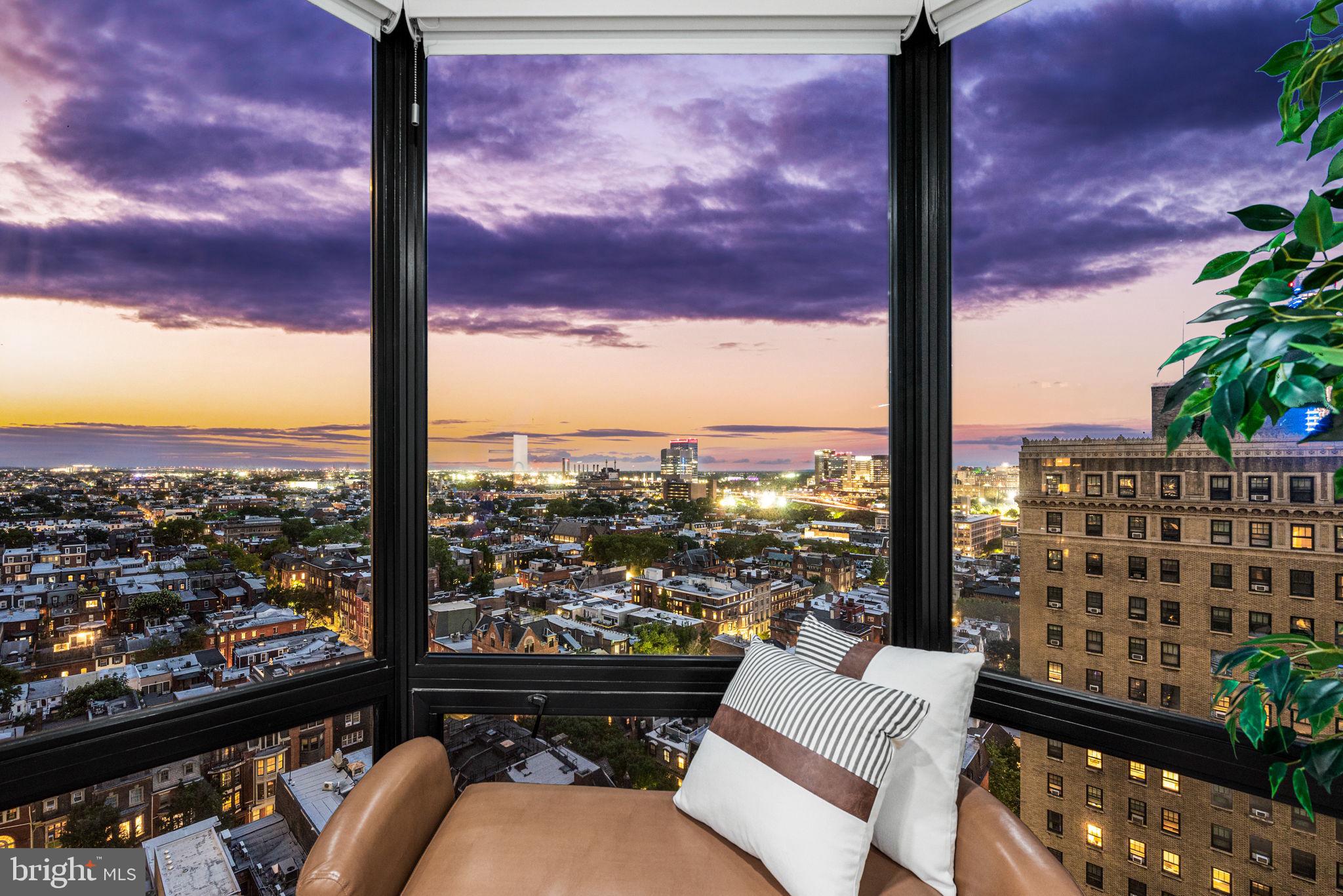 2020 Walnut Street, Unit 19LM Philadelphia, PA 19103 - Photo 13 of 60 a view of a city from a balcony with furniture