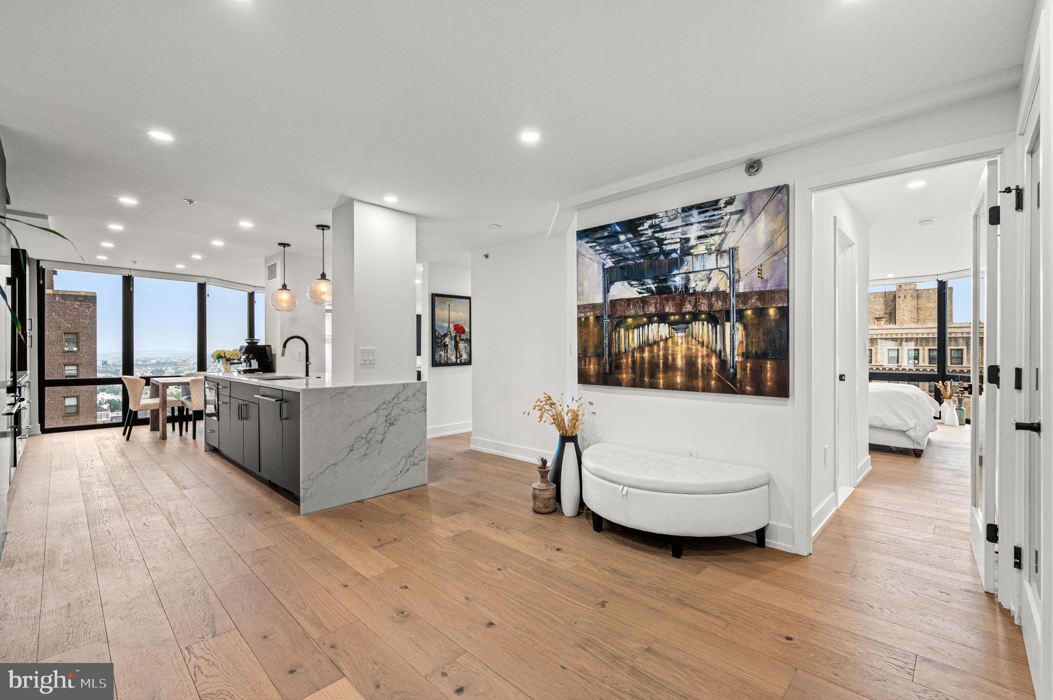 2020 Walnut Street, Unit 19LM Philadelphia, PA 19103 - Photo 14 of 60 a living room with furniture and a large window