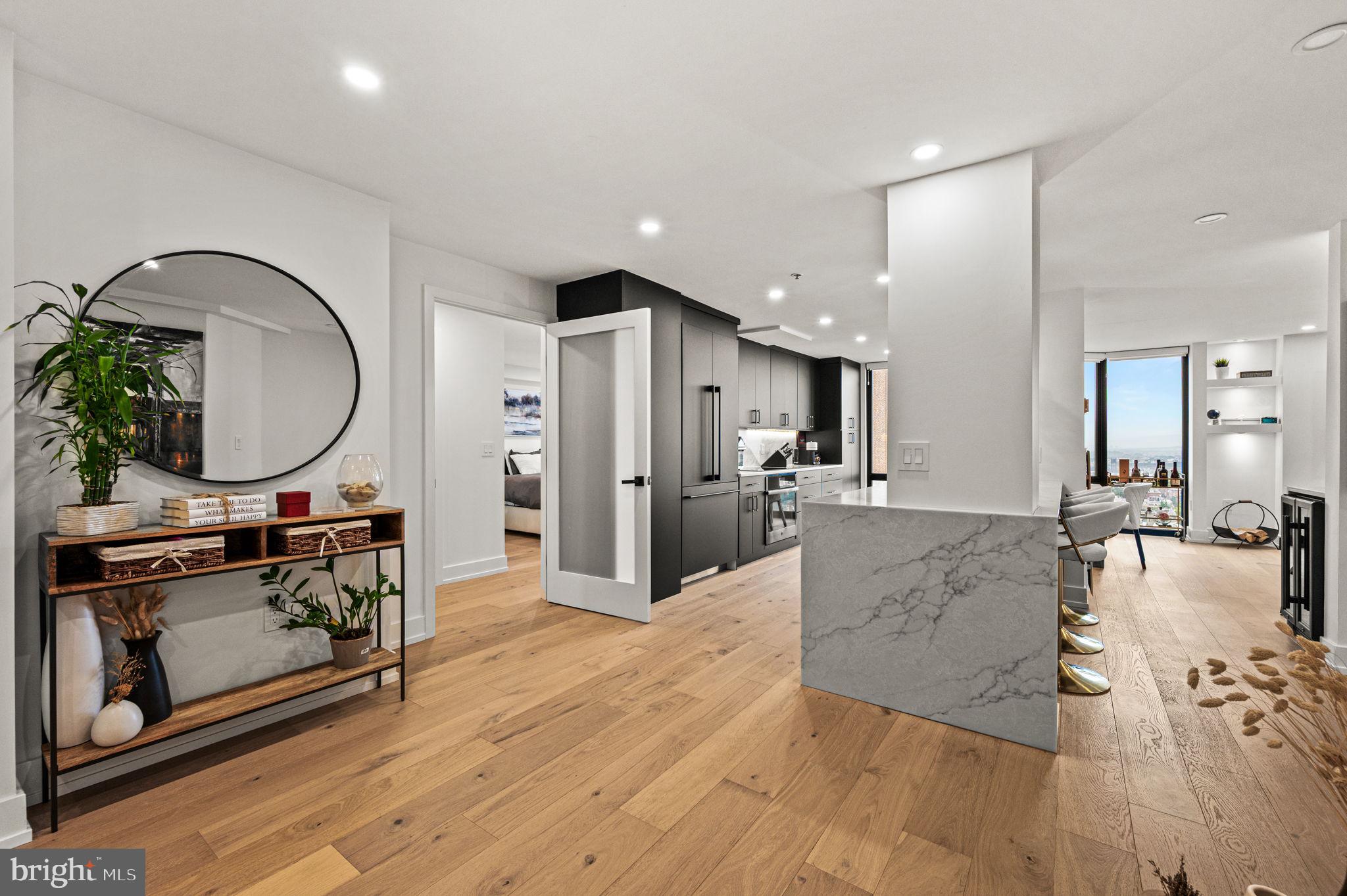 2020 Walnut Street, Unit 19LM Philadelphia, PA 19103 - Photo 15 of 60 a view of a living room kitchen and a wooden floor