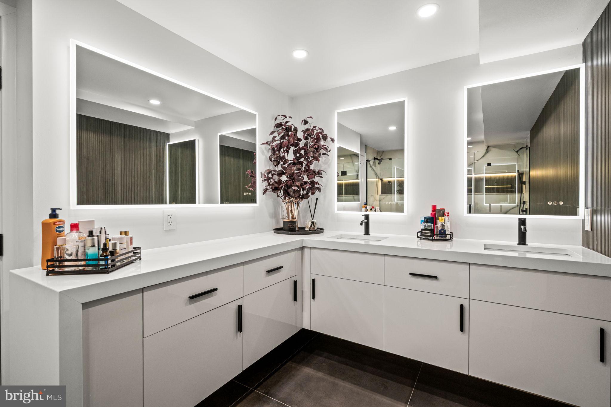 2020 Walnut Street, Unit 19LM Philadelphia, PA 19103 - Photo 20 of 60 a bathroom with a sink vanity and mirror