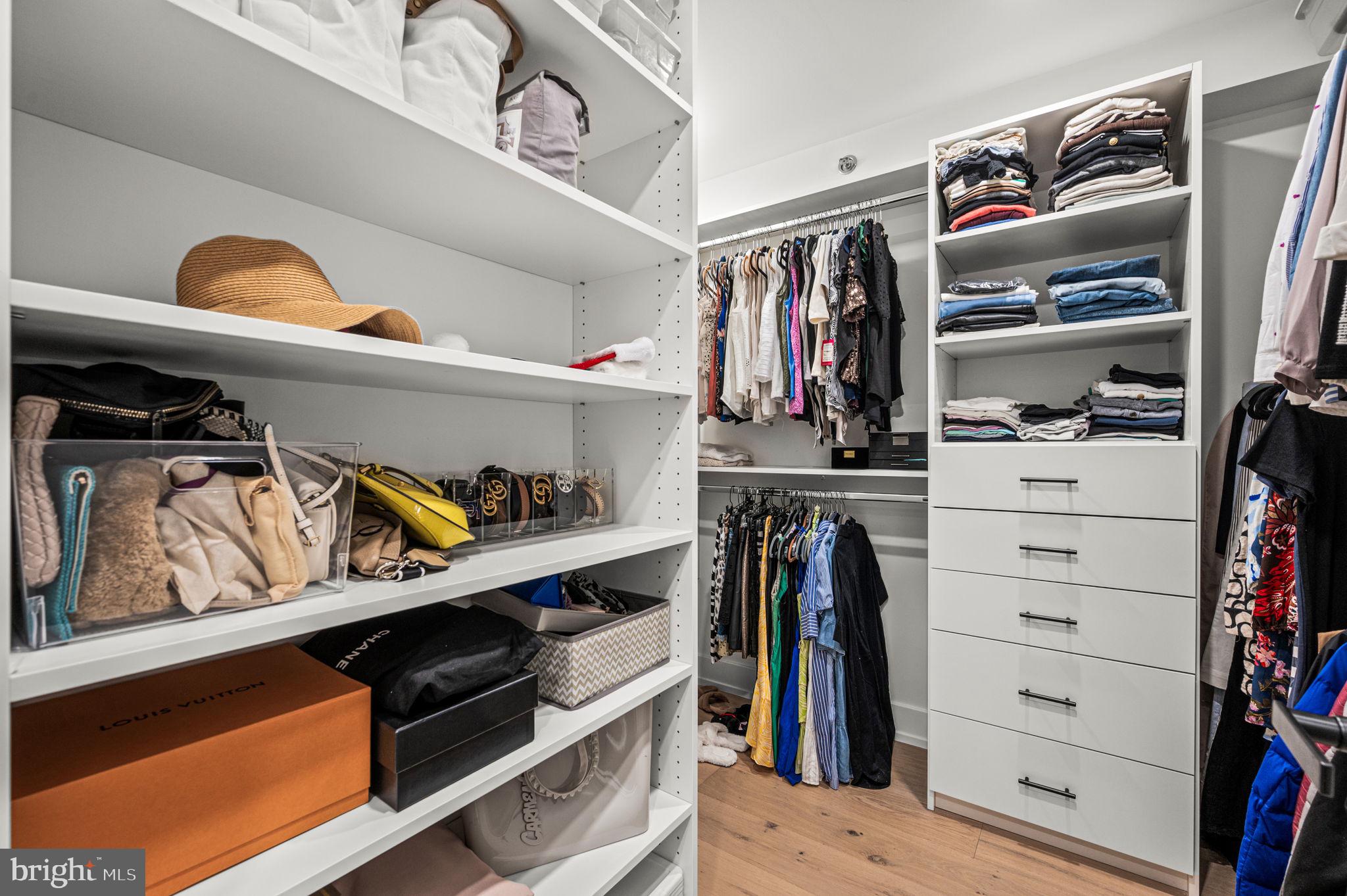 2020 Walnut Street, Unit 19LM Philadelphia, PA 19103 - Photo 22 of 60 a view of walk in closet with clothes and shoes
