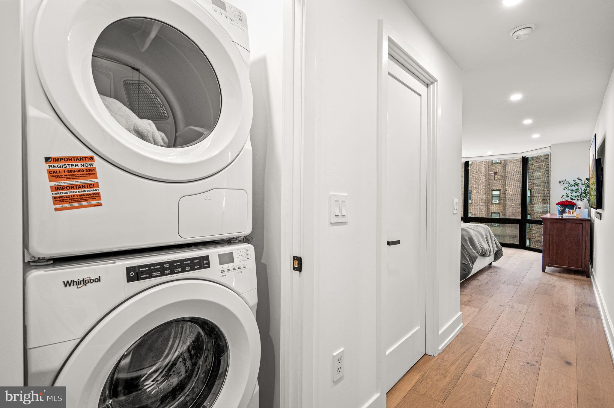 2020 Walnut Street, Unit 19LM Philadelphia, PA 19103 - Photo 23 of 60 a view of a hallway with washer and dryer