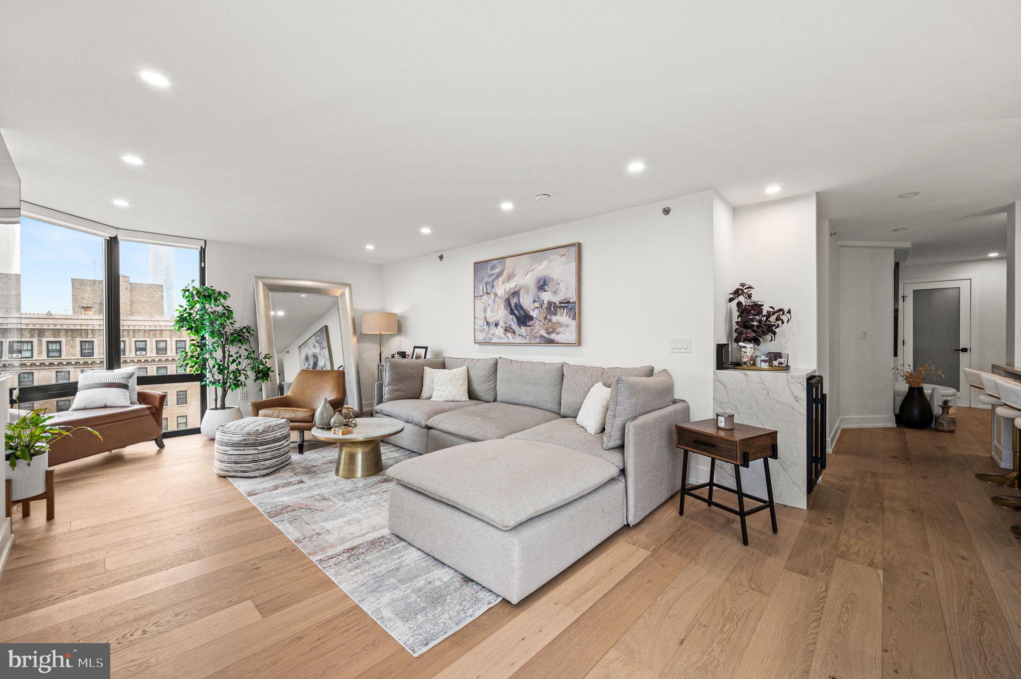 2020 Walnut Street, Unit 19LM Philadelphia, PA 19103 - Photo 26 of 60 a living room with furniture and wooden floor