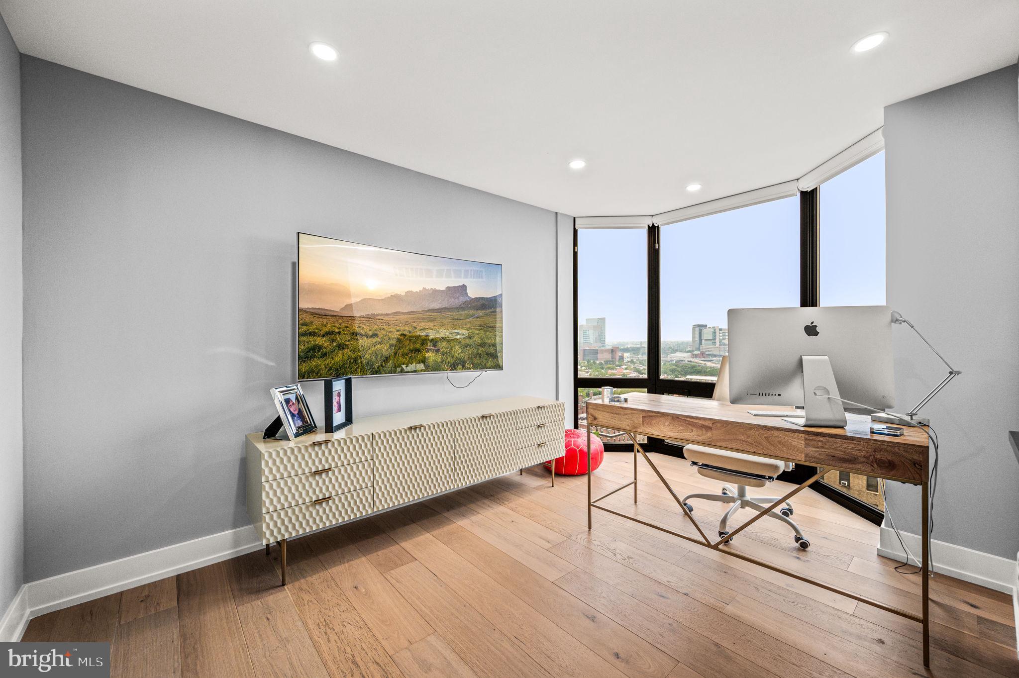 2020 Walnut Street, Unit 19LM Philadelphia, PA 19103 - Photo 31 of 60 a room with furniture and flat screen tv