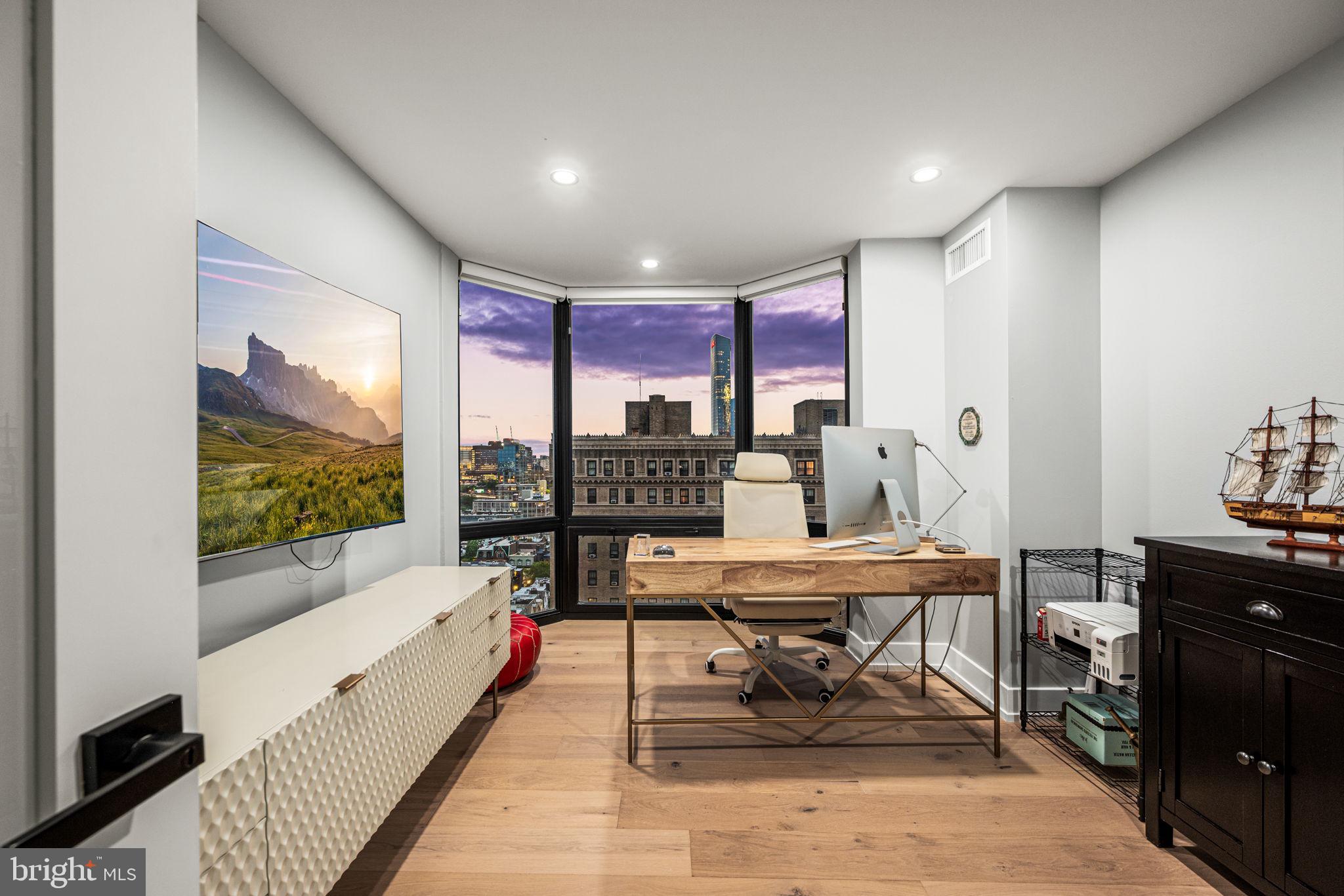 2020 Walnut Street, Unit 19LM Philadelphia, PA 19103 - Photo 33 of 60 a reading room with furniture and wooden floor