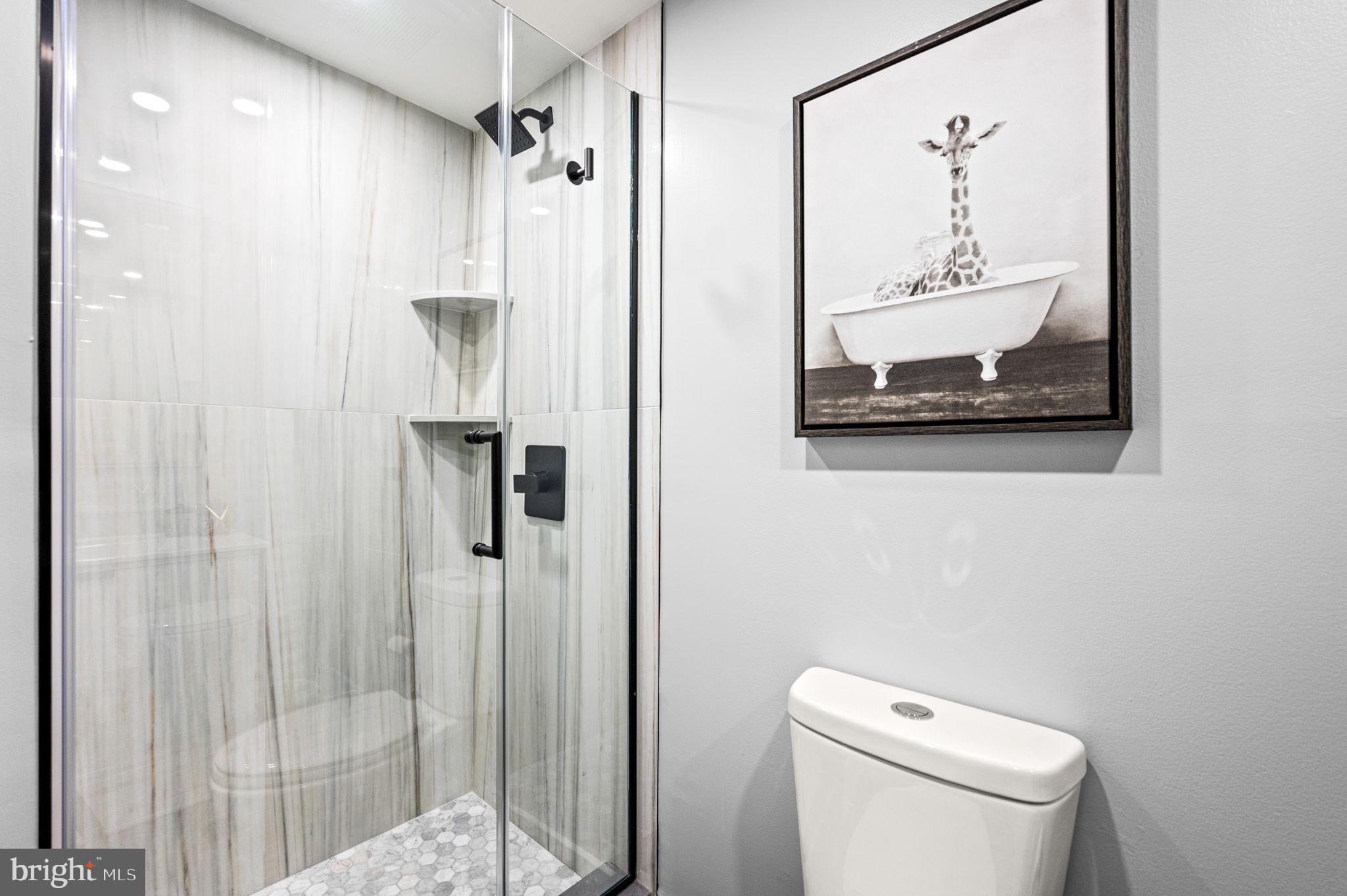 2020 Walnut Street, Unit 19LM Philadelphia, PA 19103 - Photo 34 of 60 a bathroom with a toilet and a shower