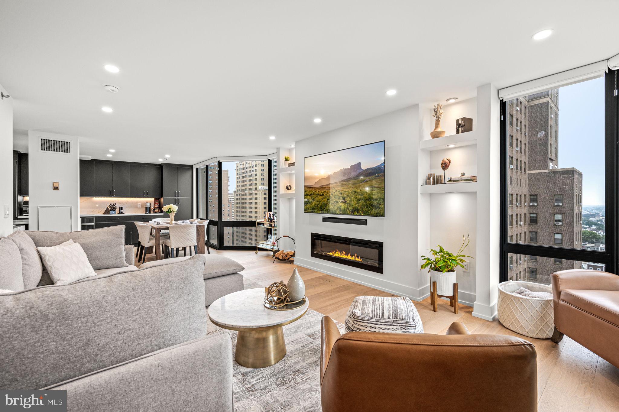 2020 Walnut Street, Unit 19LM Philadelphia, PA 19103 - Photo 4 of 60 a living room with furniture and a flat screen tv