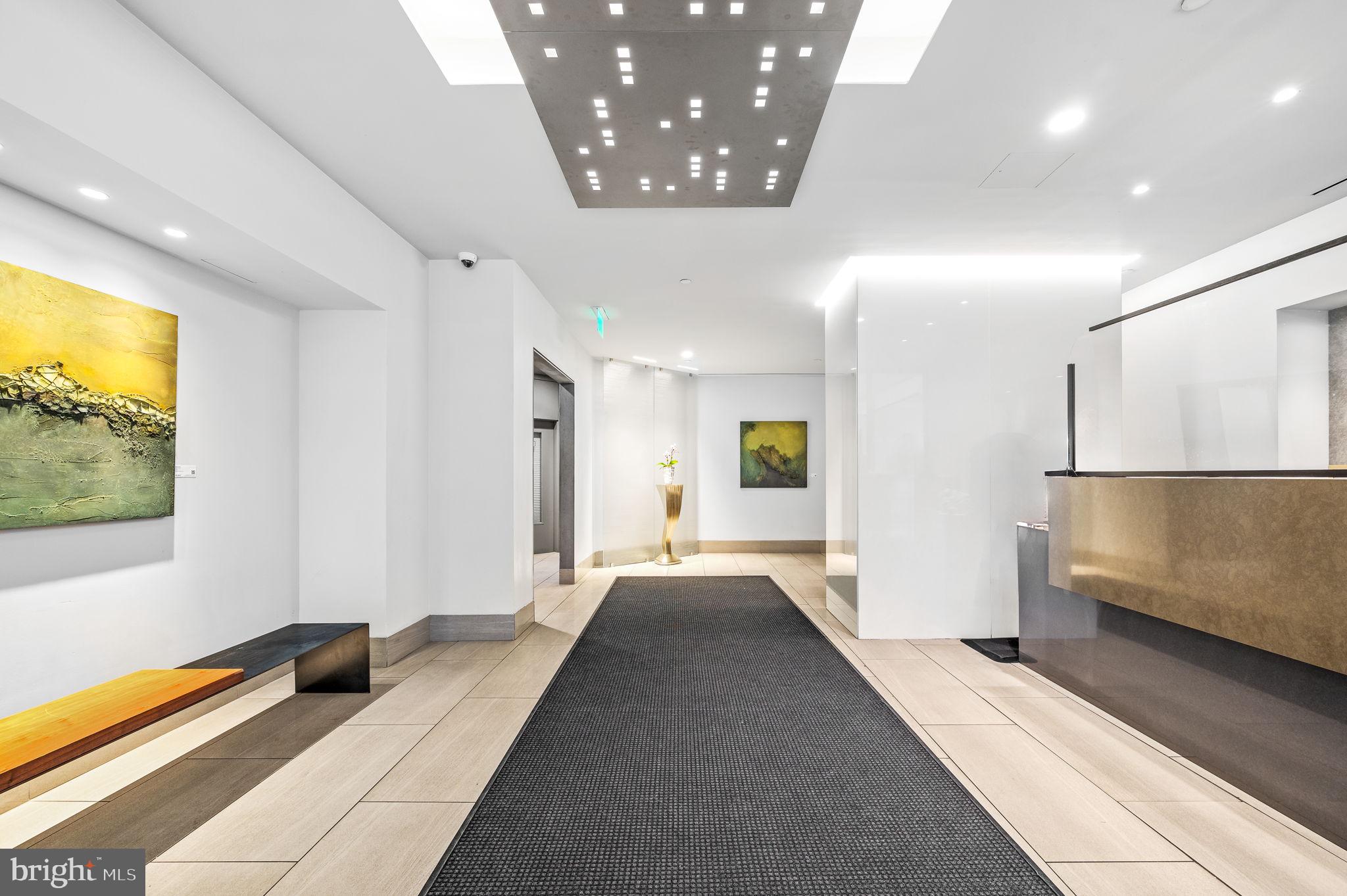 2020 Walnut Street, Unit 19LM Philadelphia, PA 19103 - Photo 57 of 60 a bedroom with a bed and a flat screen tv