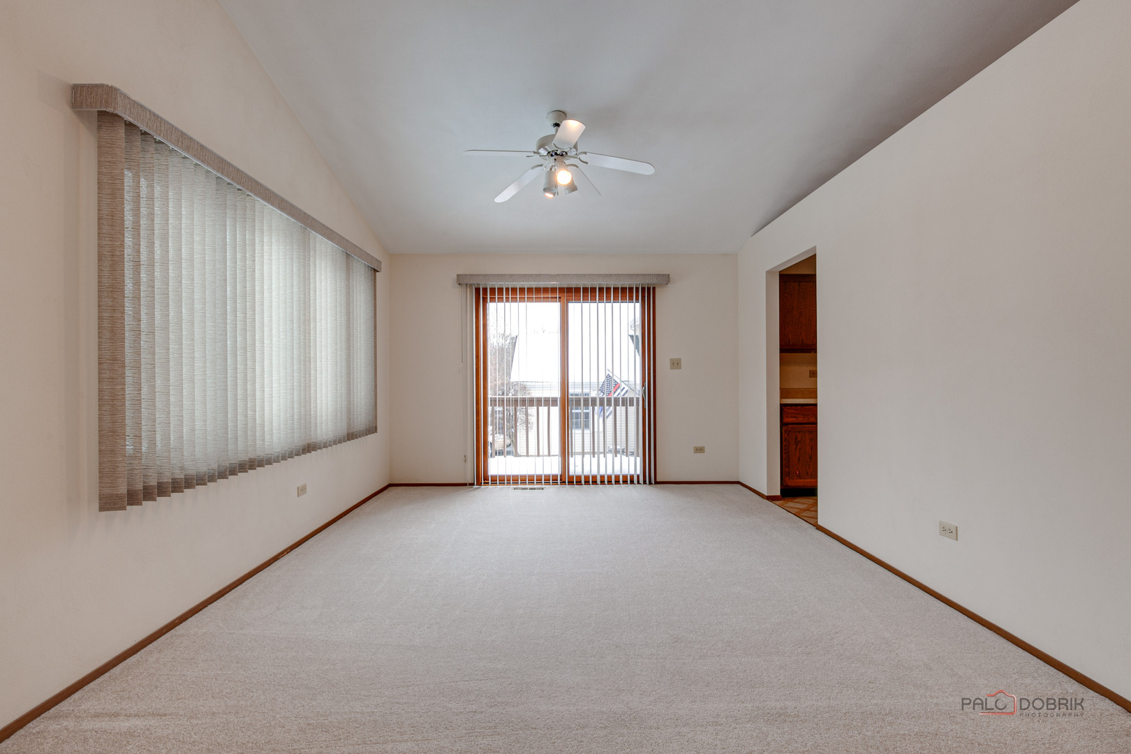 4481 Country Trail Gurnee, IL 60031 - Photo 10 of 42 an empty room with chandelier fan and windows